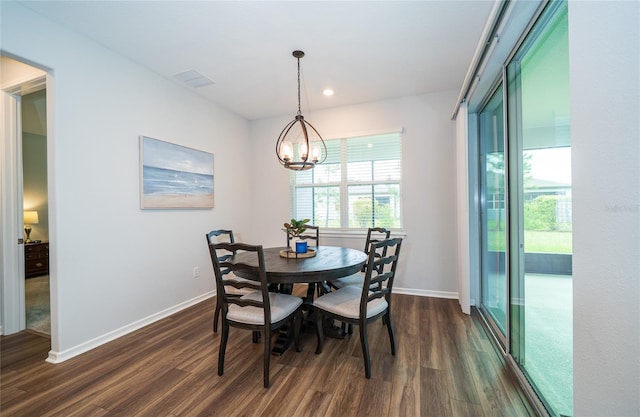 dining room featuring visible vents, baseboards, an inviting chandelier, and dark wood-style floors