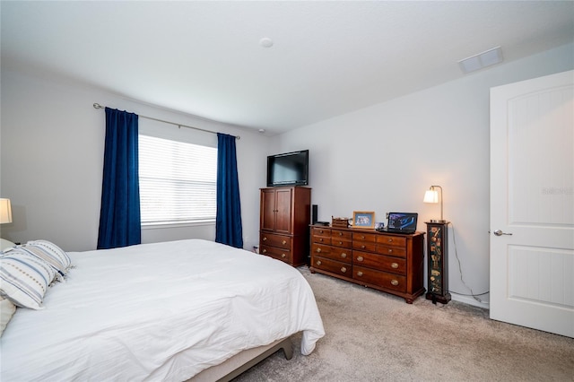 bedroom featuring carpet flooring and visible vents