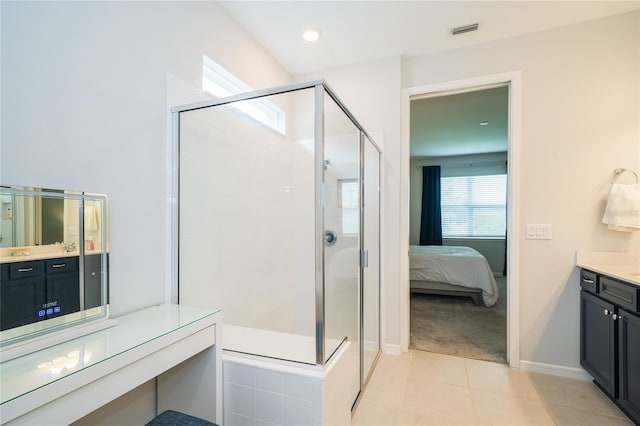 ensuite bathroom featuring visible vents, connected bathroom, a shower stall, tile patterned flooring, and vanity