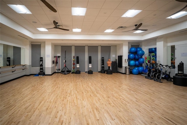 interior space with visible vents, ceiling fan, and wood finished floors