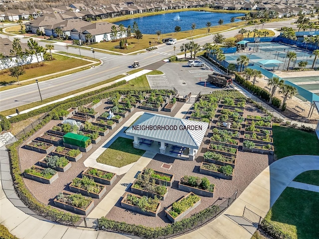 bird's eye view featuring a residential view and a water view