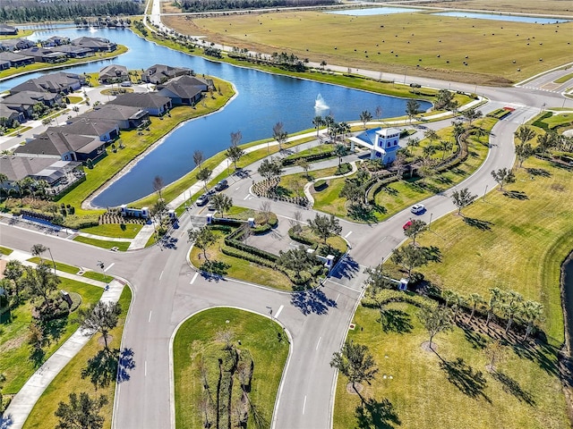 bird's eye view with a water view and a residential view