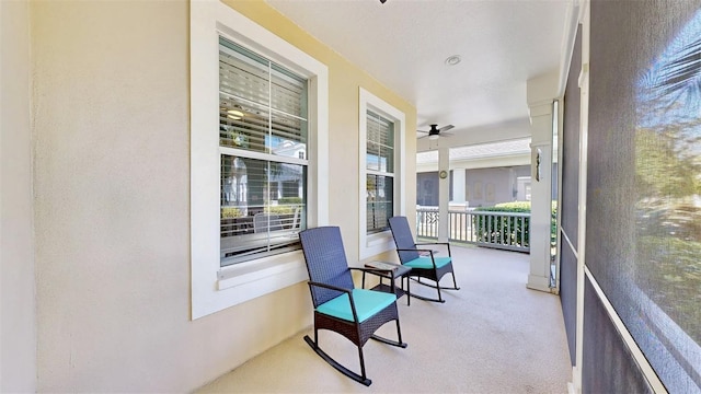 sunroom / solarium with ceiling fan