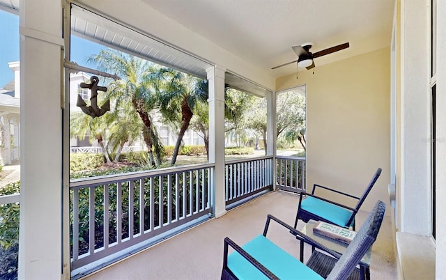 balcony featuring a ceiling fan and covered porch