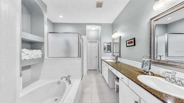 full bath with a bath, visible vents, a sink, and tile patterned floors