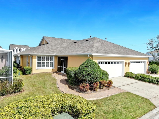 exterior space with an attached garage, roof with shingles, concrete driveway, and stucco siding