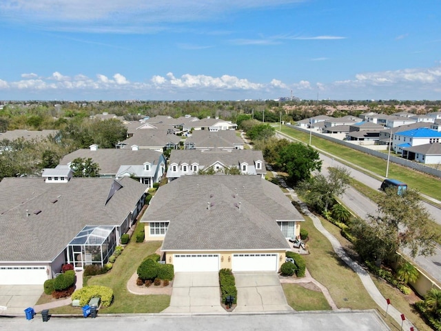 birds eye view of property with a residential view