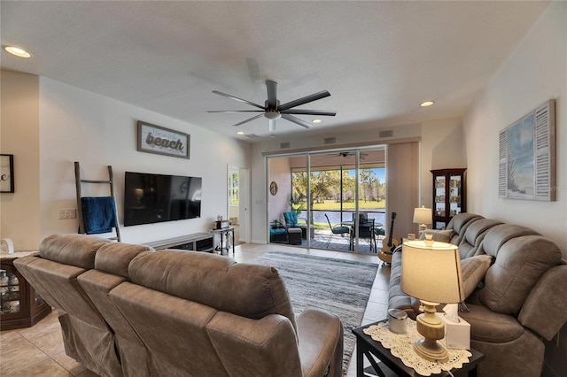 living room featuring light tile patterned flooring, recessed lighting, a textured ceiling, and ceiling fan