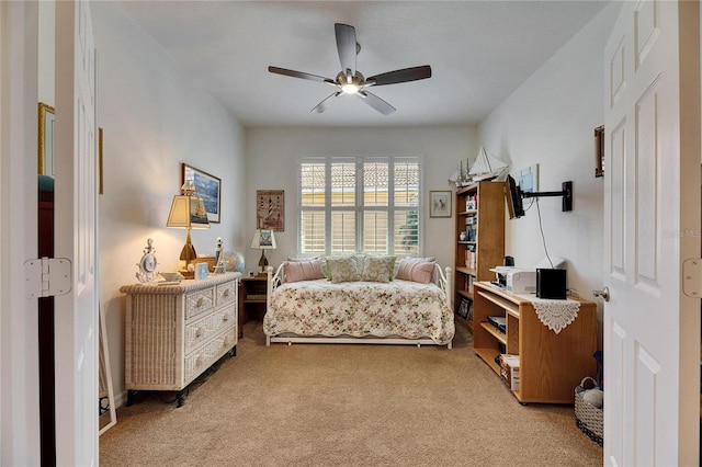 sitting room with light colored carpet and ceiling fan