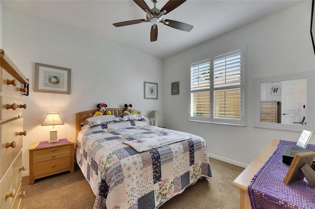 carpeted bedroom with baseboards and a ceiling fan