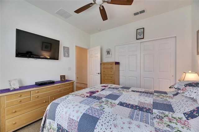 bedroom with a closet, visible vents, and ceiling fan