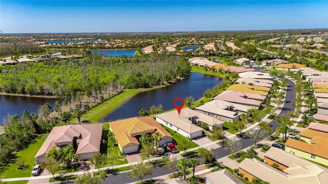 birds eye view of property with a residential view and a water view