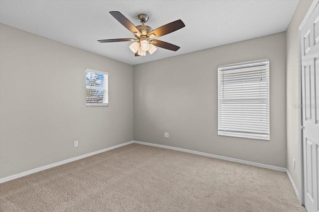 unfurnished bedroom with a ceiling fan, baseboards, and carpet floors