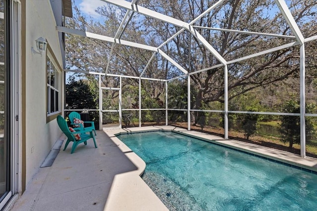 outdoor pool with a patio area and a lanai