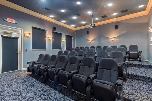 home theater with visible vents, crown molding, and carpet floors