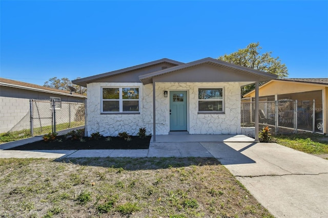 view of front of home with a gate and fence