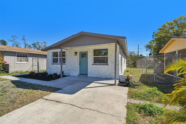 bungalow-style house with a gate and fence