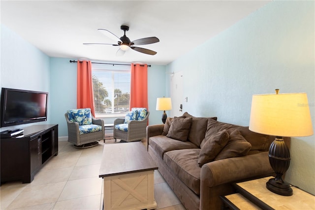 living room featuring light tile patterned floors and ceiling fan