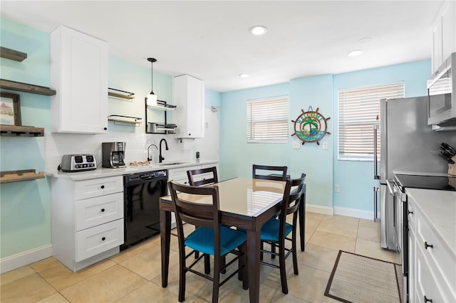 kitchen featuring light countertops, decorative backsplash, stainless steel appliances, white cabinetry, and open shelves