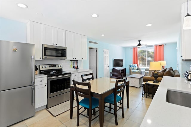 kitchen with a sink, light countertops, visible vents, and stainless steel appliances