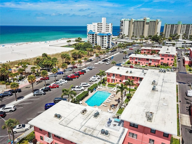 birds eye view of property featuring a city view, a view of the beach, and a water view