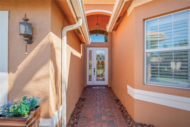 entrance to property with stucco siding