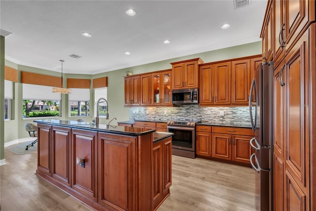 kitchen featuring tasteful backsplash, crown molding, stainless steel appliances, and brown cabinetry