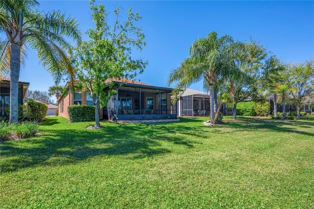 view of yard with a sunroom