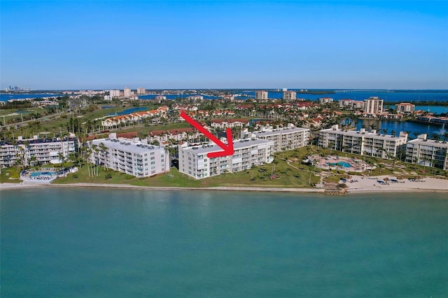 birds eye view of property featuring a water view and a view of city