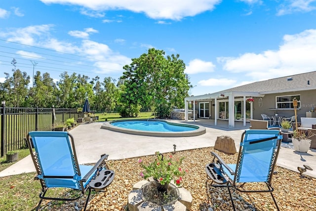 view of pool with a fenced in pool, a patio, and fence