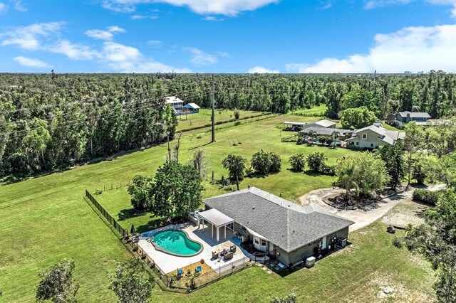 bird's eye view featuring a rural view and a wooded view