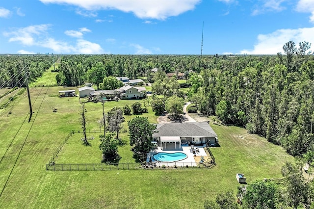 birds eye view of property with a wooded view