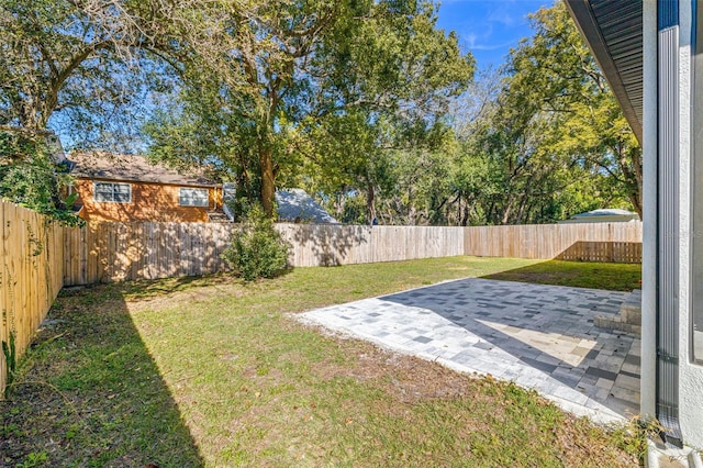 view of yard with a patio and a fenced backyard