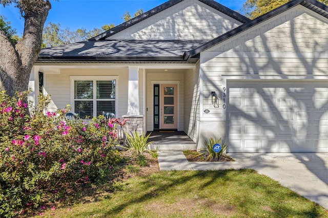 property entrance with a garage, covered porch, and a shingled roof