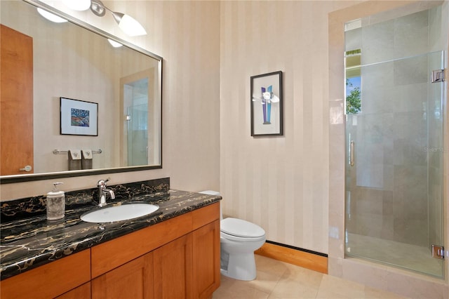 full bath with a shower stall, wallpapered walls, toilet, tile patterned floors, and vanity