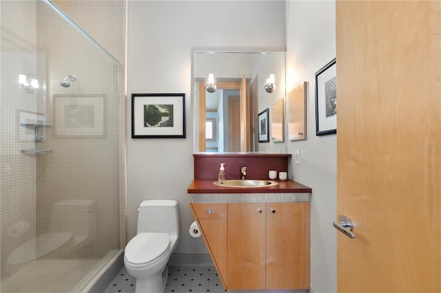 full bathroom with tiled shower, toilet, vanity, and tile patterned flooring