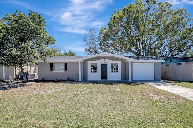 ranch-style house with a front yard, fence, a garage, and driveway