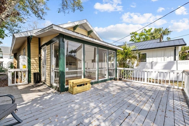 wooden terrace with a sunroom