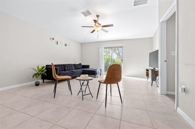 living room featuring light tile patterned floors, visible vents, baseboards, and ceiling fan