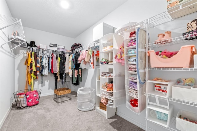 walk in closet featuring carpet