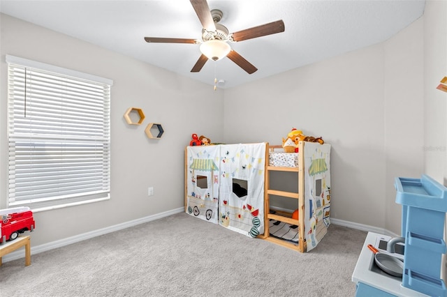 game room featuring baseboards, carpet, and a ceiling fan