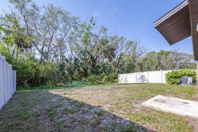 view of yard featuring cooling unit and a fenced backyard