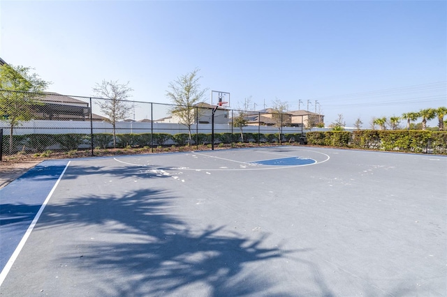 view of basketball court featuring community basketball court and fence