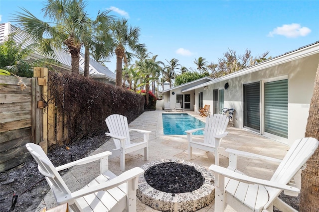 view of swimming pool with a fenced in pool, a fenced backyard, and a patio area