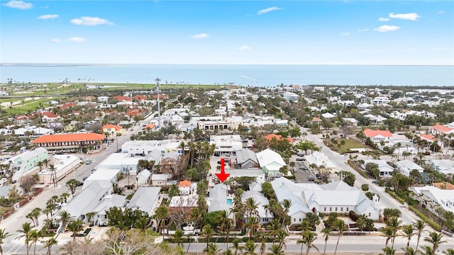 birds eye view of property featuring a residential view and a water view