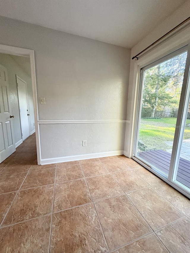 empty room with baseboards