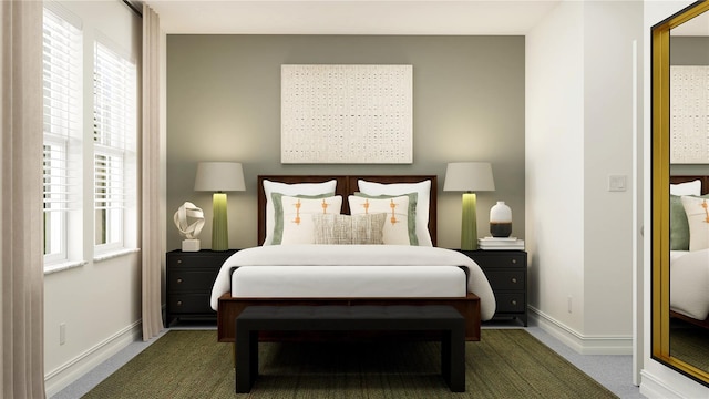 bedroom featuring baseboards and carpet