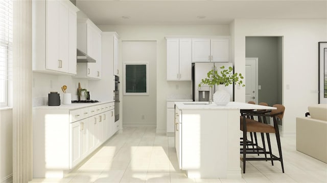 kitchen featuring a kitchen island, stainless steel appliances, light countertops, under cabinet range hood, and a kitchen bar