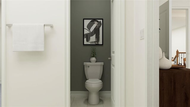 bathroom with tile patterned flooring, toilet, and baseboards