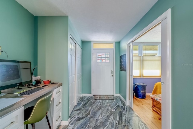 foyer entrance with baseboards